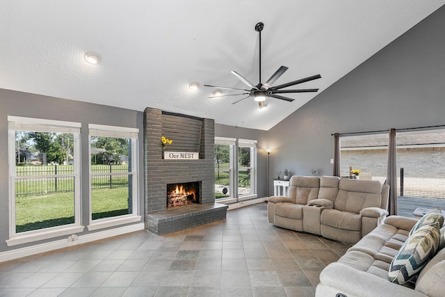 20107 Sunny Shores Dr, Humble, TX 77346 - living area with ceiling fan, a brick fireplace, high vaulted ceiling, tile patterned flooring, and baseboards