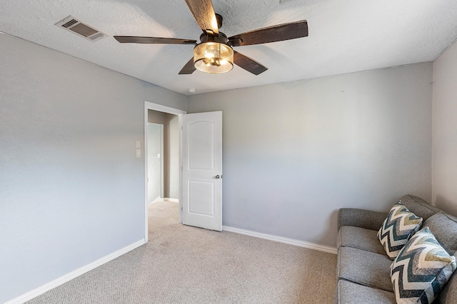 20107 Sunny Shores Dr, Humble, TX 77346 - living area with light carpet, a ceiling fan, and baseboards