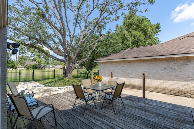 20107 Sunny Shores Dr, Humble, TX 77346 - wooden terrace featuring outdoor dining space and a fenced backyard