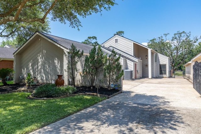 20107 Sunny Shores Dr, Humble, TX 77346 - view of front of property featuring cooling unit and concrete driveway