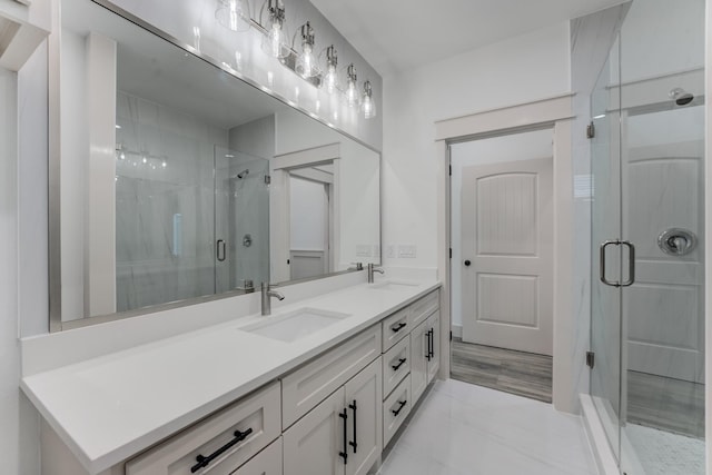337 Todd St, Tomball, TX 77375 - full bathroom with double vanity, a shower stall, and marble finish flooring