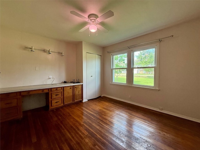 3918 County Road 507, Brazoria, TX 77422 - unfurnished office featuring dark wood-type flooring, ceiling fan, and baseboards