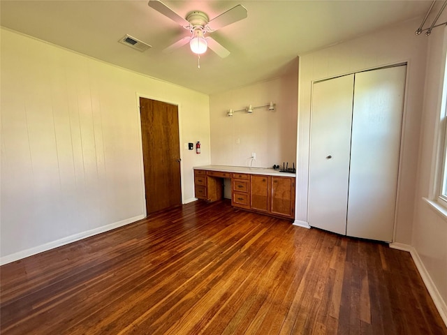 3918 County Road 507, Brazoria, TX 77422 - unfurnished bedroom with dark wood-style flooring, a closet, baseboards, and ceiling fan