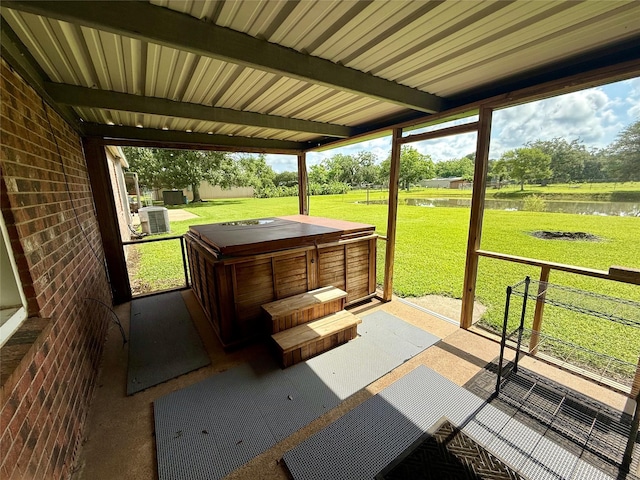 3918 County Road 507, Brazoria, TX 77422 - view of patio with a hot tub, a water view, and central air condition unit