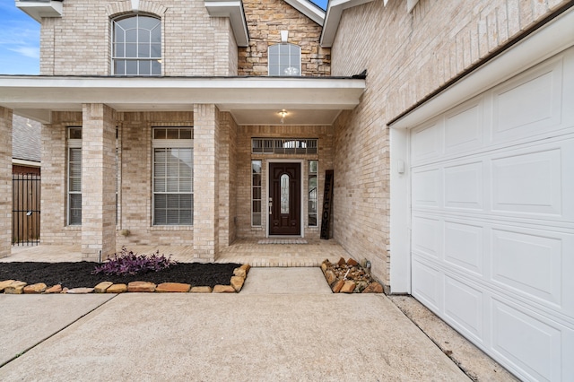 11902 Miramar Shores Dr, Houston, TX 77065 - entrance to property with covered porch, an attached garage, and brick siding