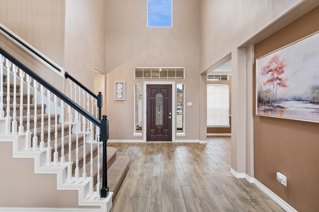 11902 Miramar Shores Dr, Houston, TX 77065 - foyer entrance featuring wood finished floors, baseboards, stairs, and a towering ceiling