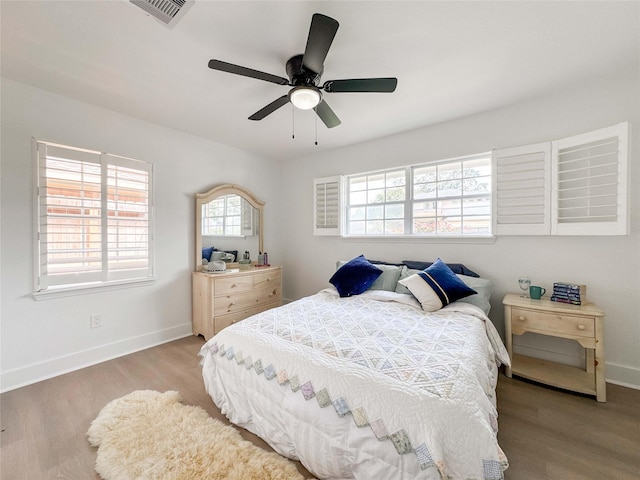 2302 Hewitt Dr, Houston, TX 77018 - bedroom featuring wood finished floors, baseboards, and ceiling fan