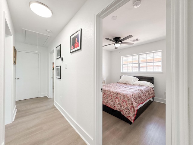 2302 Hewitt Dr, Houston, TX 77018 - bedroom with attic access, light wood-style floors, baseboards, and ceiling fan