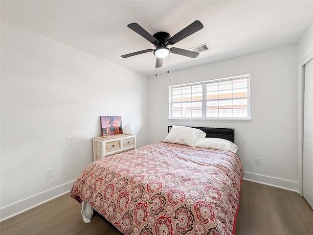 2302 Hewitt Dr, Houston, TX 77018 - bedroom with dark wood-style floors, baseboards, and a ceiling fan