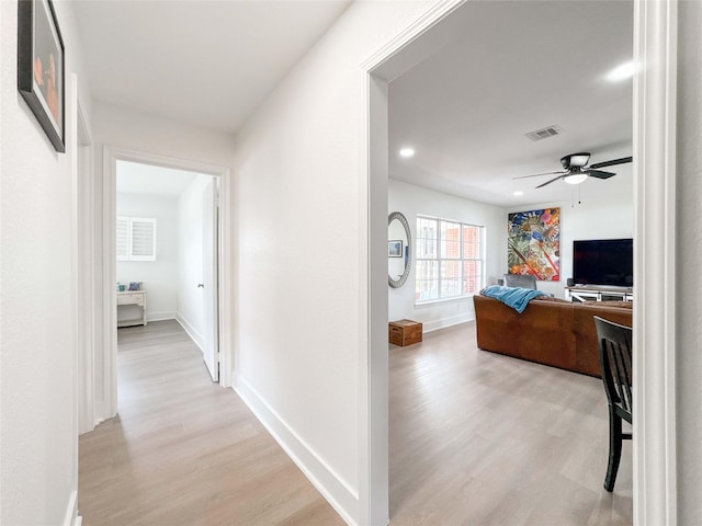 2302 Hewitt Dr, Houston, TX 77018 - hall featuring light wood-style flooring, baseboards, and recessed lighting