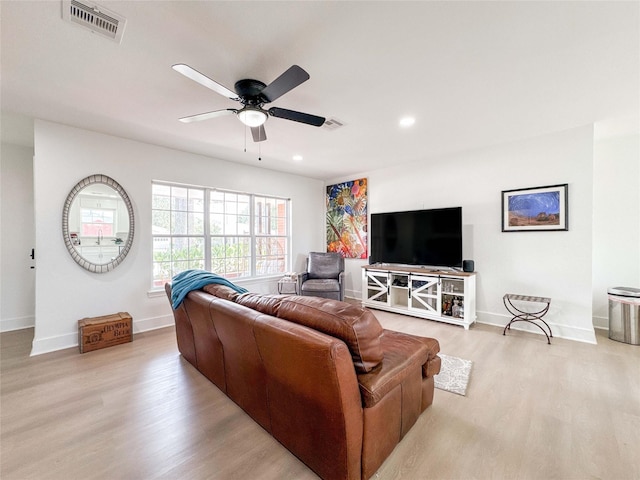 2302 Hewitt Dr, Houston, TX 77018 - living room with light wood finished floors, a ceiling fan, baseboards, and recessed lighting