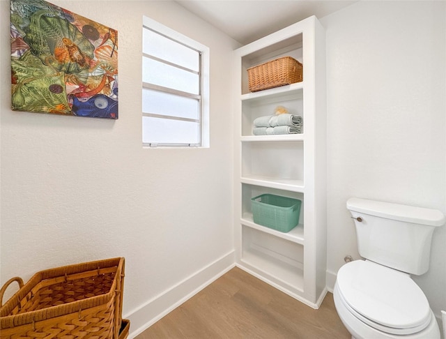 2302 Hewitt Dr, Houston, TX 77018 - bathroom with wood finished floors, baseboards, and toilet
