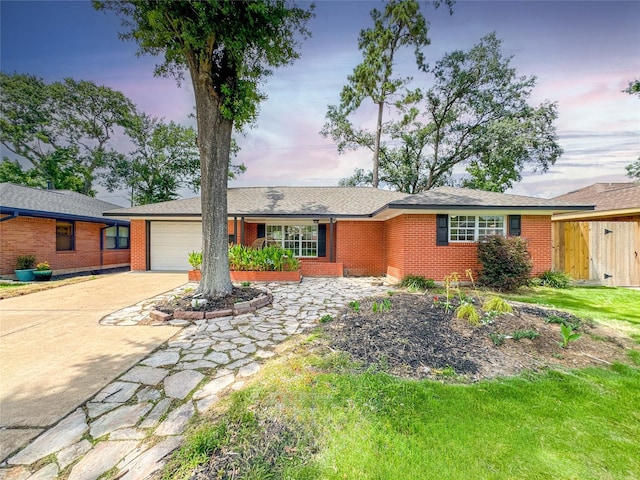 2302 Hewitt Dr, Houston, TX 77018 - ranch-style house with brick siding, an attached garage, and driveway