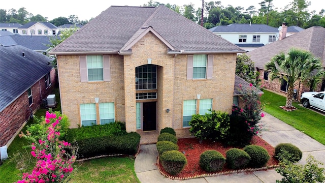 2534 Honeysuckle Walk, Spring, TX 77388 - traditional-style home with brick siding and roof with shingles
