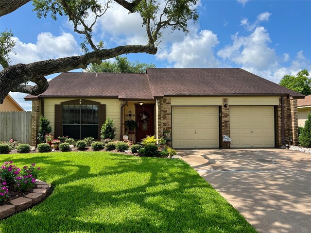 728 S Remington Dr, Angleton, TX 77515 - view of front facade featuring an attached garage, concrete driveway, brick siding, and a shingled roof