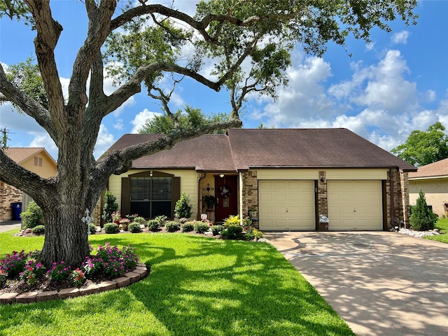 728 S Remington Dr, Angleton, TX 77515 - view of front of property with an attached garage, driveway, a front yard, brick siding, and a shingled roof