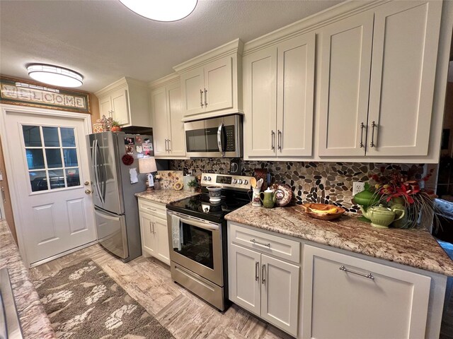 728 S Remington Dr, Angleton, TX 77515 - kitchen with stainless steel appliances, backsplash, light wood-type flooring, and light stone countertops