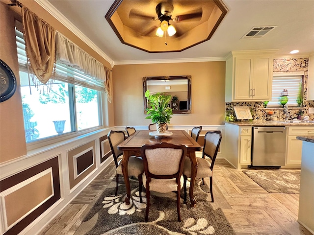 728 S Remington Dr, Angleton, TX 77515 - dining room with a raised ceiling, a ceiling fan, and crown molding