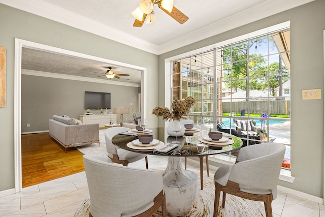 24714 Valleylight Dr, Katy, TX 77494 - dining space featuring ceiling fan, crown molding, and baseboards