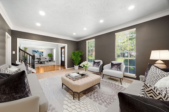 24714 Valleylight Dr, Katy, TX 77494 - living area featuring crown molding, a textured ceiling, recessed lighting, healthy amount of natural light, and wood finished floors