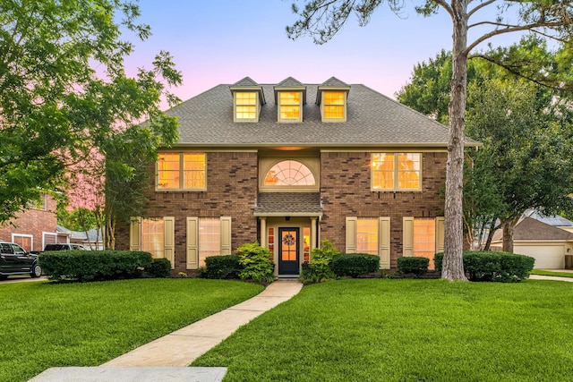 24714 Valleylight Dr, Katy, TX 77494 - colonial-style house featuring a lawn, brick siding, and a shingled roof