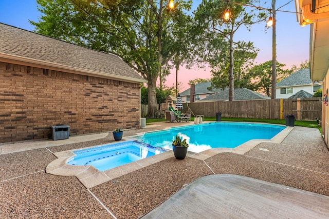 24714 Valleylight Dr, Katy, TX 77494 - view of swimming pool with a fenced backyard, a pool with connected hot tub, and a patio