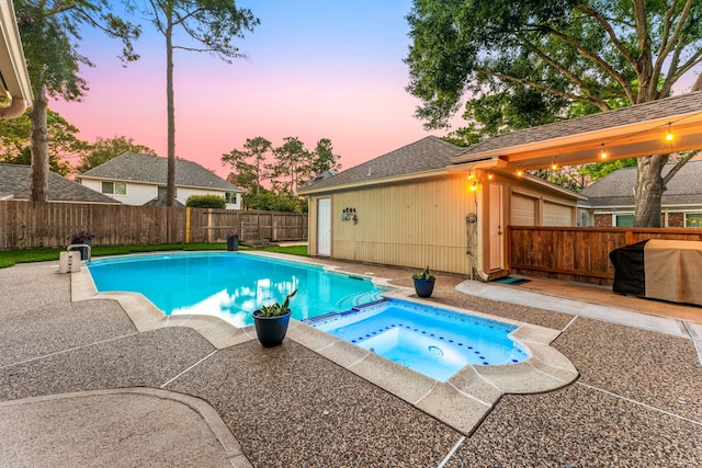 24714 Valleylight Dr, Katy, TX 77494 - view of swimming pool featuring a patio, a fenced backyard, a pool with connected hot tub, and grilling area