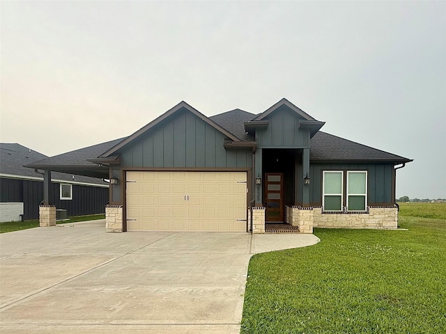 535 Longhorn Trl, Angleton, TX 77515 - view of front of house with board and batten siding, concrete driveway, an attached garage, a front yard, and stone siding