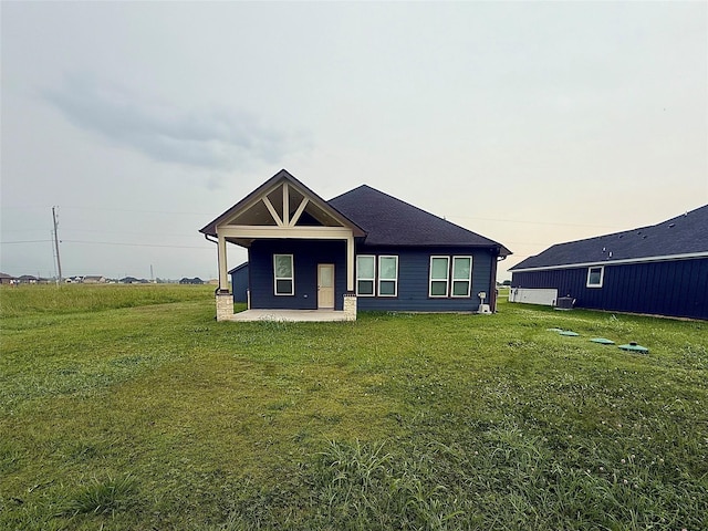 535 Longhorn Trl, Angleton, TX 77515 - view of front of house featuring a patio area and a front lawn