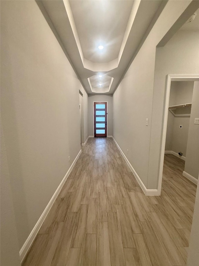 535 Longhorn Trl, Angleton, TX 77515 - corridor featuring light wood finished floors, baseboards, and a raised ceiling