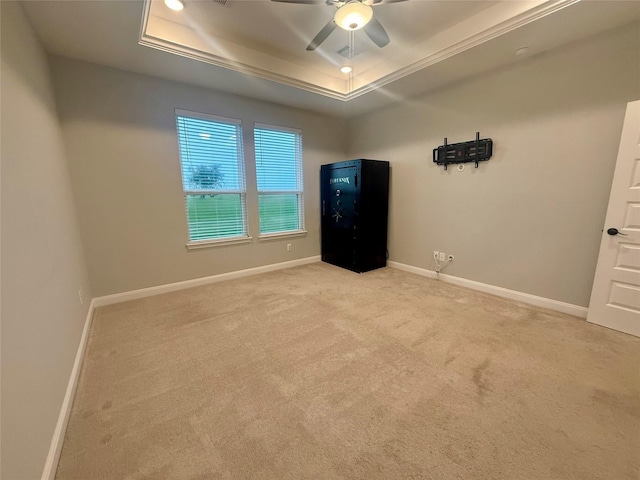 535 Longhorn Trl, Angleton, TX 77515 - empty room with a raised ceiling, light carpet, baseboards, and ceiling fan