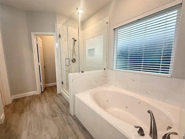 535 Longhorn Trl, Angleton, TX 77515 - bathroom featuring a tub with jets, a shower stall, wood finished floors, and baseboards