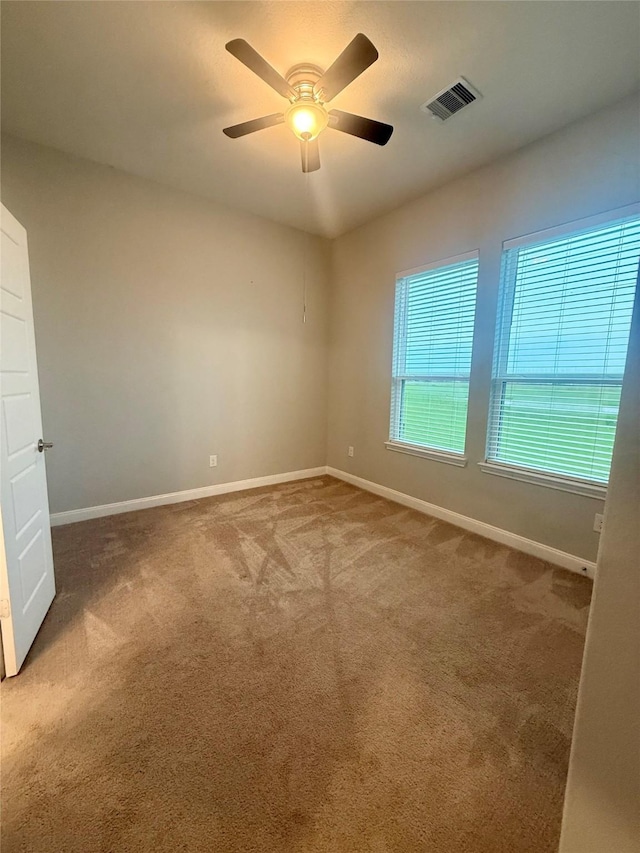 535 Longhorn Trl, Angleton, TX 77515 - unfurnished room with carpet floors, baseboards, and a ceiling fan