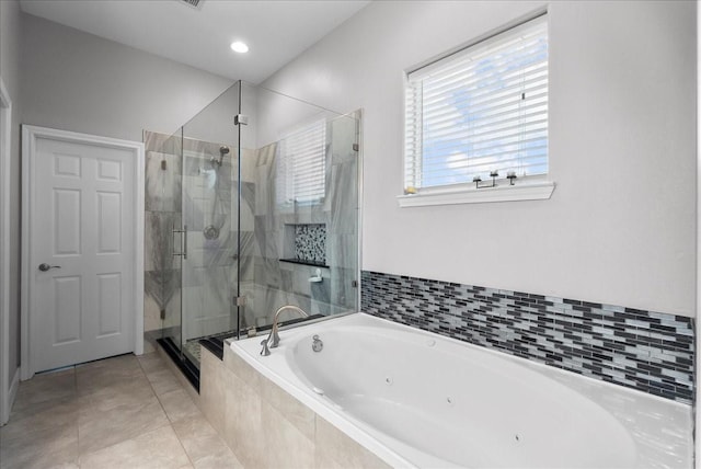 7014 Terrasso Dr, Hitchcock, TX 77563 - bathroom featuring a jetted tub, a stall shower, and tile patterned floors