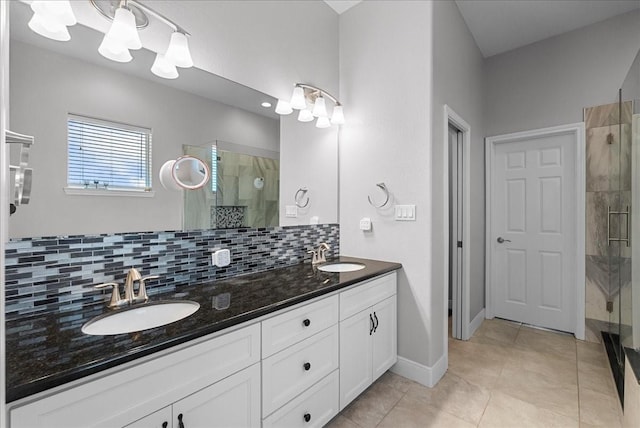 7014 Terrasso Dr, Hitchcock, TX 77563 - bathroom featuring a shower stall, decorative backsplash, double vanity, tile patterned flooring, and baseboards
