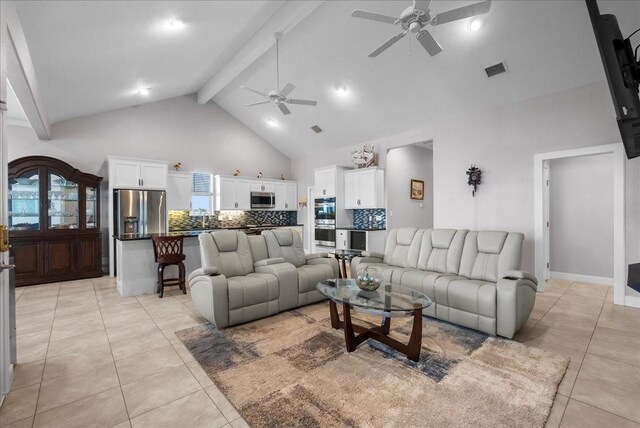 7014 Terrasso Dr, Hitchcock, TX 77563 - living room with a ceiling fan, high vaulted ceiling, beamed ceiling, and light tile patterned floors