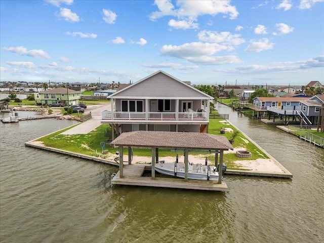 7014 Terrasso Dr, Hitchcock, TX 77563 - dock with a water view, boat lift, a residential view, and a fire pit