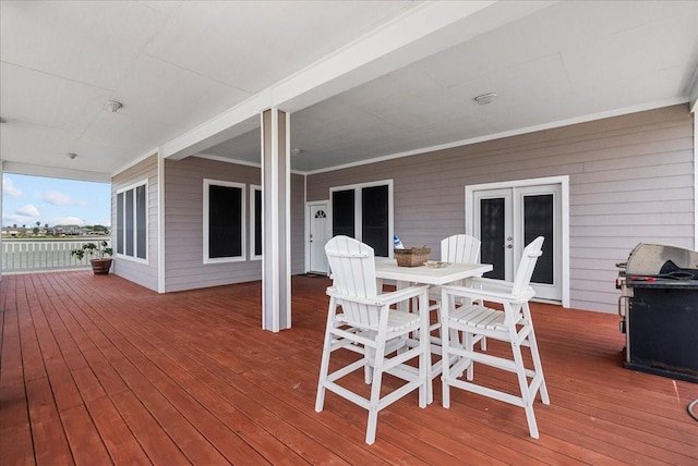 7014 Terrasso Dr, Hitchcock, TX 77563 - deck with a grill and outdoor dining space