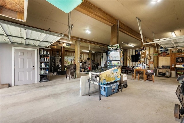 7014 Terrasso Dr, Hitchcock, TX 77563 - garage featuring a workshop area and a garage door opener