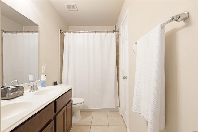 3502 Barrington Ct, Pearland, TX 77584 - full bath featuring toilet, double vanity, tile patterned flooring, and a shower with shower curtain