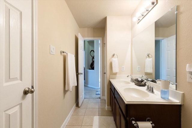 3502 Barrington Ct, Pearland, TX 77584 - bathroom featuring tile patterned flooring, double vanity, and baseboards