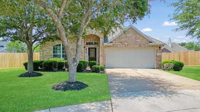3502 Barrington Ct, Pearland, TX 77584 - view of front of property with an attached garage, concrete driveway, and brick siding
