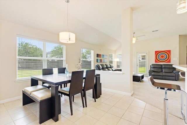3502 Barrington Ct, Pearland, TX 77584 - dining area with baseboards, light tile patterned floors, and vaulted ceiling