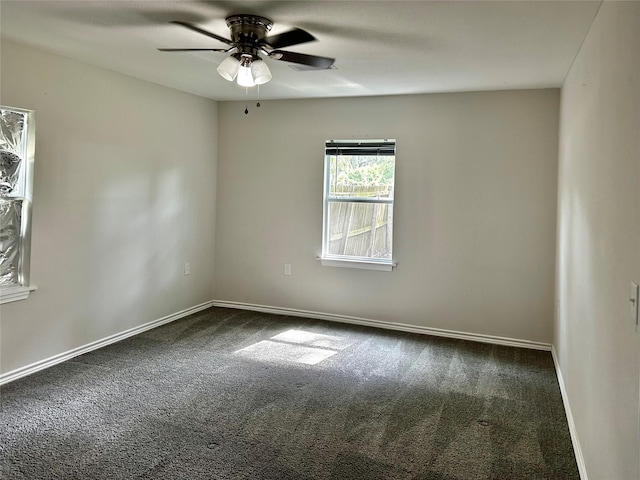 827 Live Oak Dr, Jones Creek, TX 77541 - spare room featuring dark carpet, ceiling fan, and baseboards