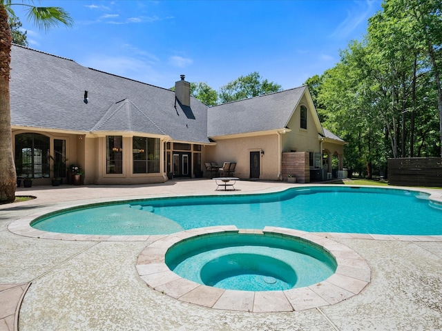 9819 Crestwater Cir, Magnolia, TX 77354 - view of swimming pool with a patio area and a pool with connected hot tub