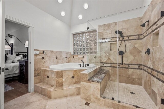 9819 Crestwater Cir, Magnolia, TX 77354 - ensuite bathroom featuring a bath, a shower stall, and vaulted ceiling