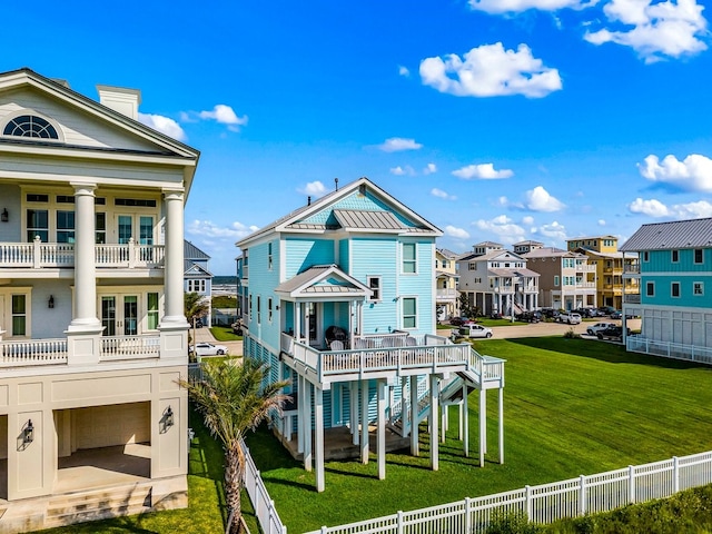 8 Grand Beach Blvd, Galveston, TX 77550 - back of property featuring a residential view and a chimney