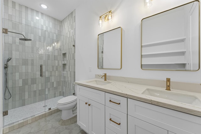 1316 E 34th St, Houston, TX 77022 - full bath featuring a stall shower, toilet, double vanity, recessed lighting, and tile patterned floors