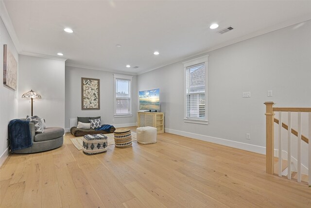 11 Caravelle Ct, Galveston, TX 77554 - living area featuring recessed lighting, ornamental molding, wood finished floors, and baseboards