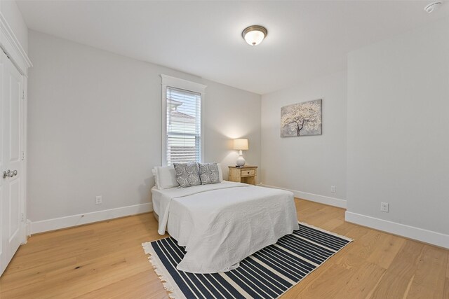 11 Caravelle Ct, Galveston, TX 77554 - bedroom with light wood-type flooring and baseboards